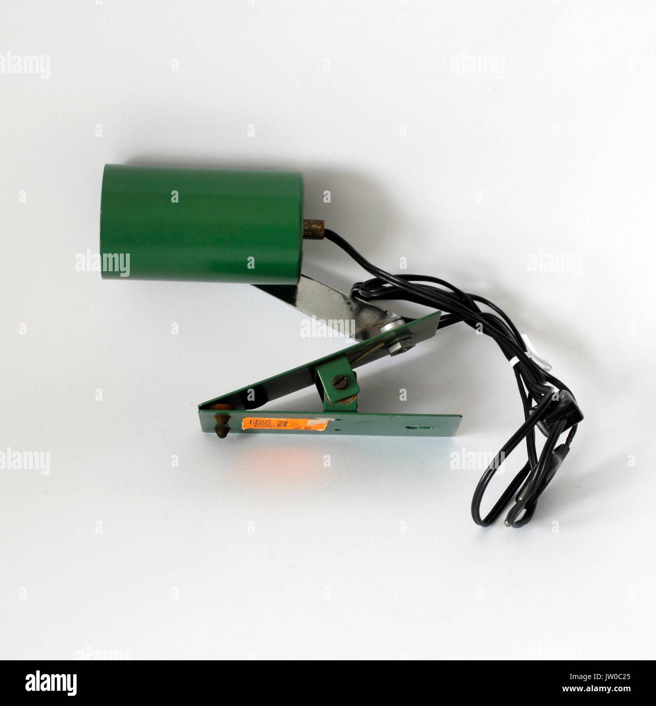 Vintage orientable clamp lamp, made by metal painted green. INDE brand