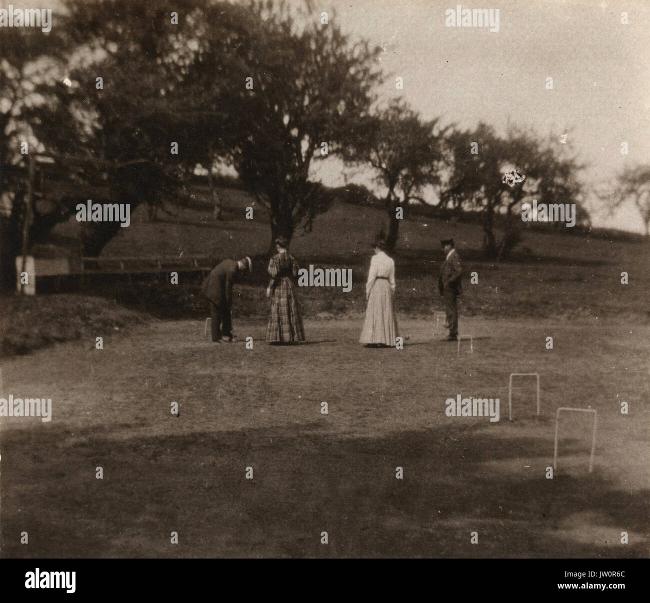 Photograph depicting men and women playing croquet Stock Photo