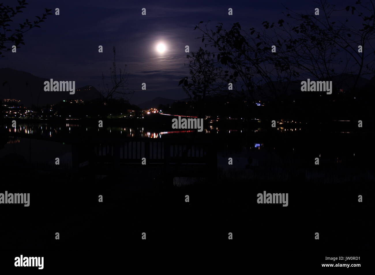 The moon shining over a lake in Switzerland, Europe Stock Photo - Alamy