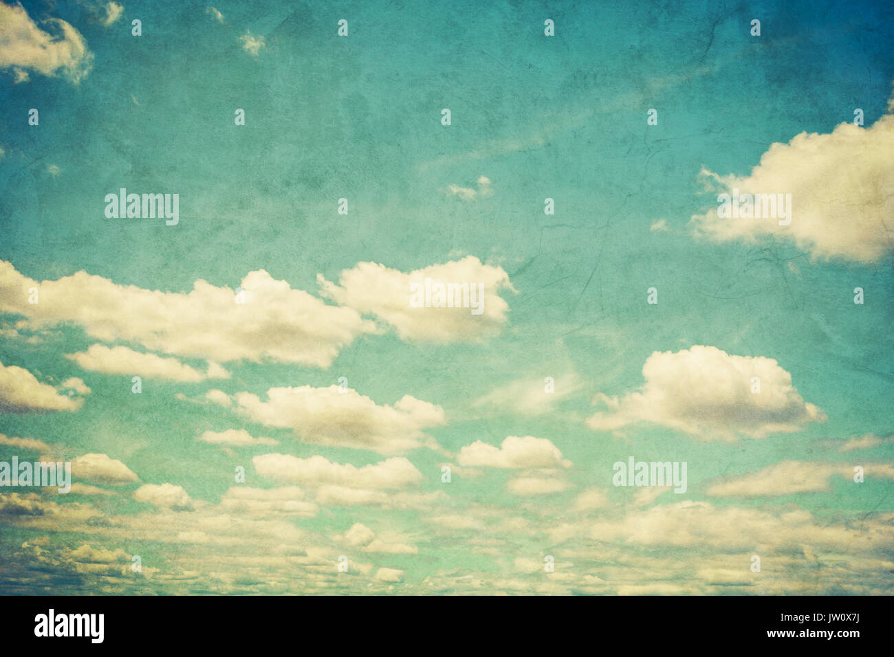 Grunge blue sky and white clouds with vintage effect. Stock Photo