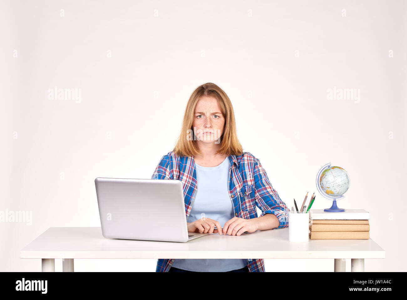 Teenage student at desk Stock Photo Alamy