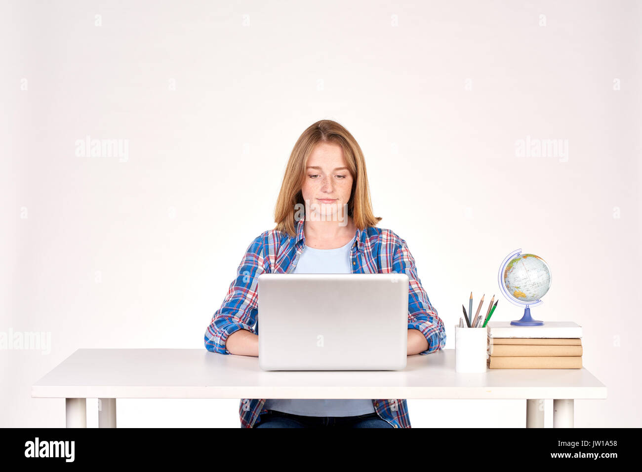 Teenage student at desk Stock Photo Alamy