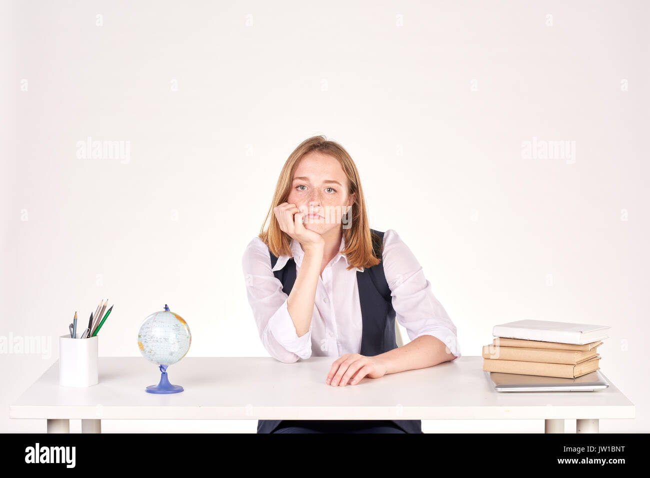 Girl studying at desk Stock Photo - Alamy