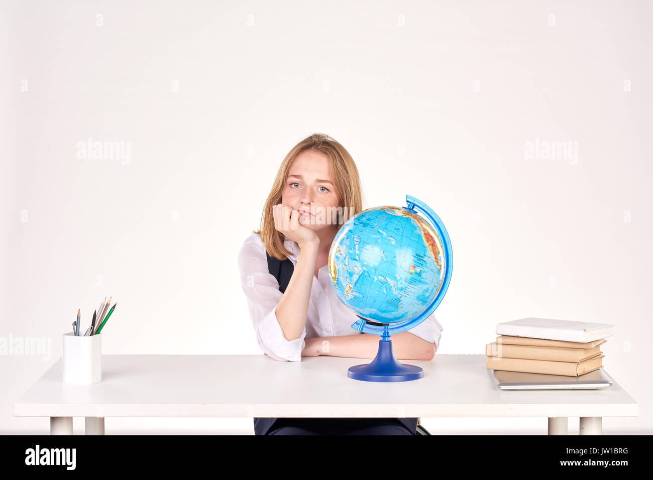 Girl studying at desk Stock Photo - Alamy