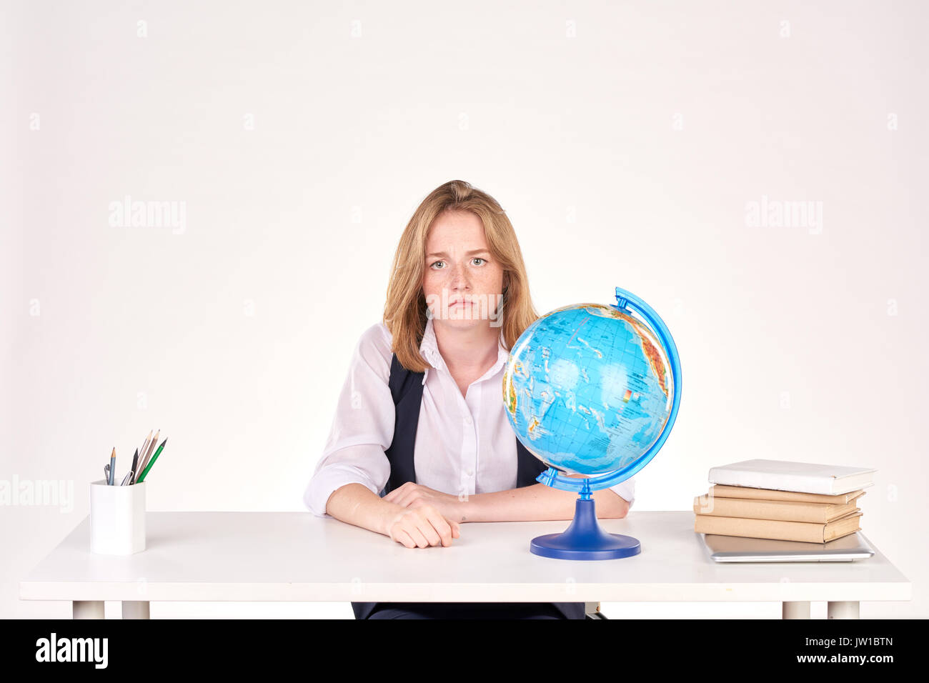 Girl studying at desk Stock Photo - Alamy