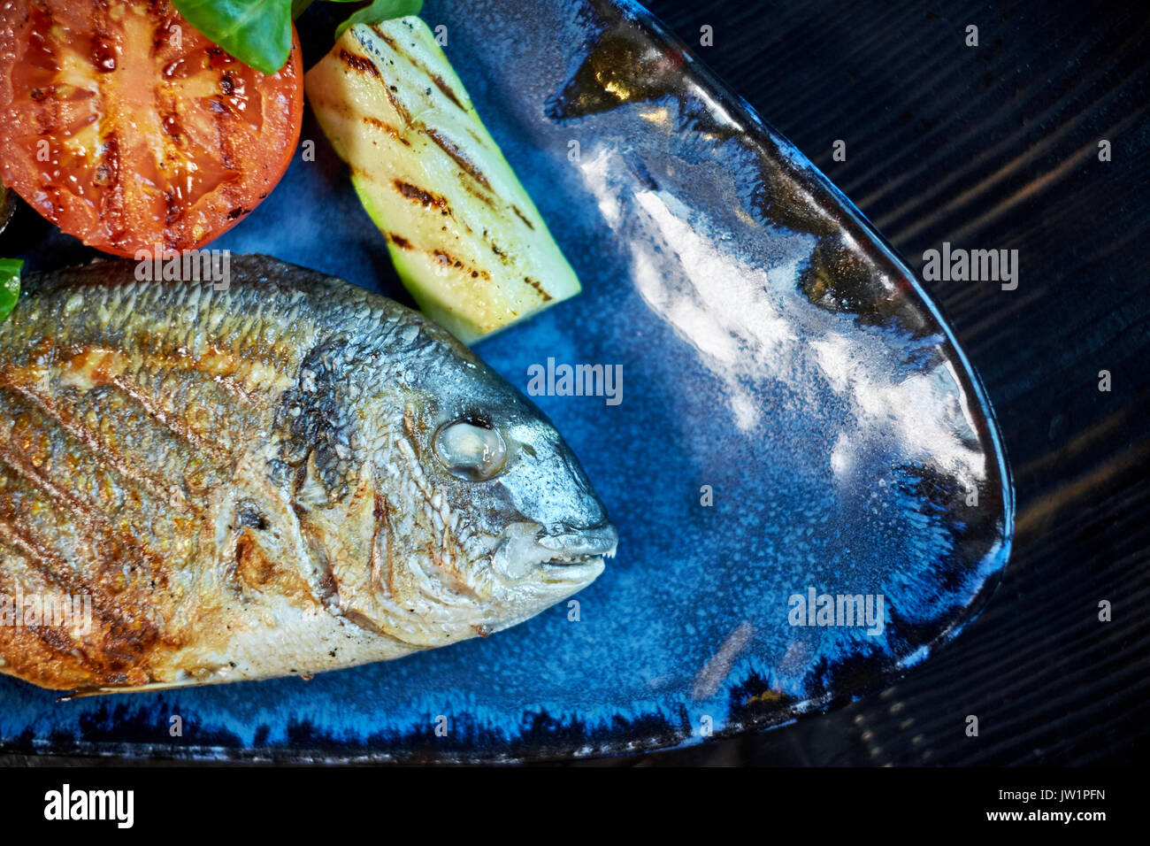 Grilled Fish dish roasted fish and vegetables jpg Stock Photo Alamy