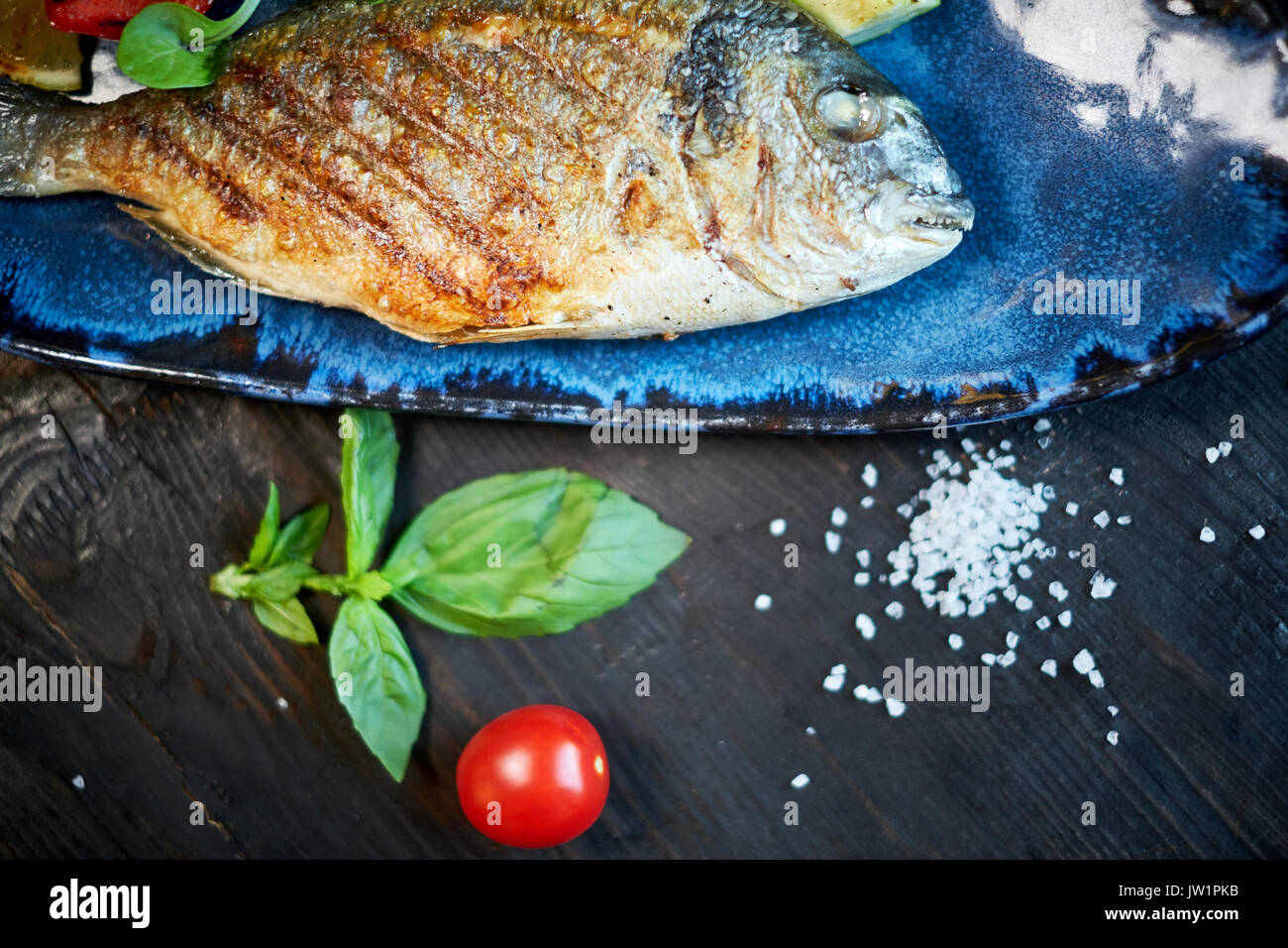 Grilled Fish dish roasted fish and vegetables jpg Stock Photo Alamy