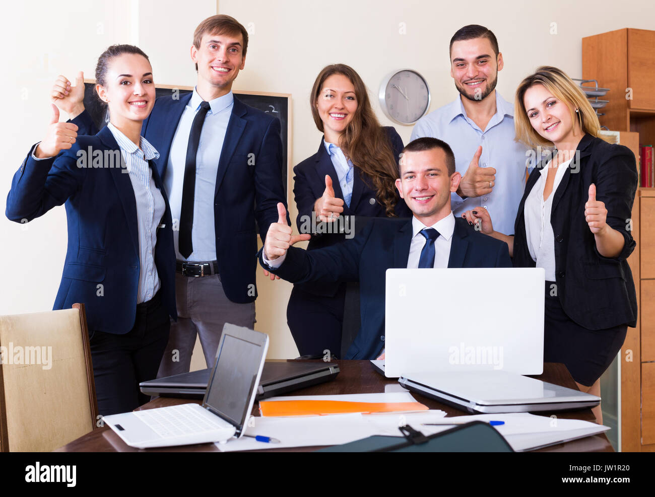 Happy business team posing in hi-res stock photography and images - Alamy
