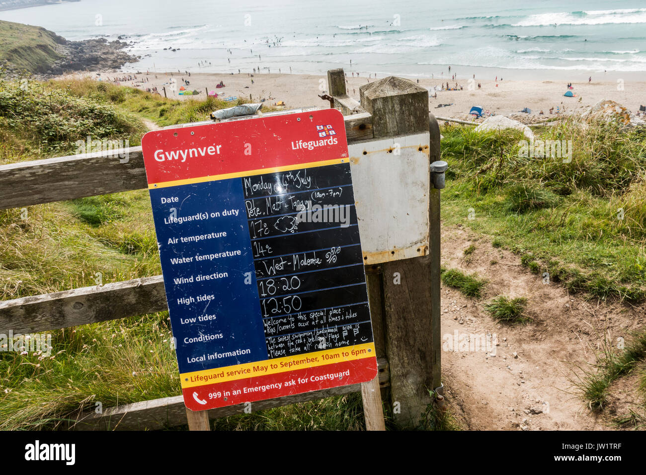Lifeguard notice board with details of tides, temperature, etc, at Gwynver Beach, near Penzance, Cornwall, England, UK. Stock Photo