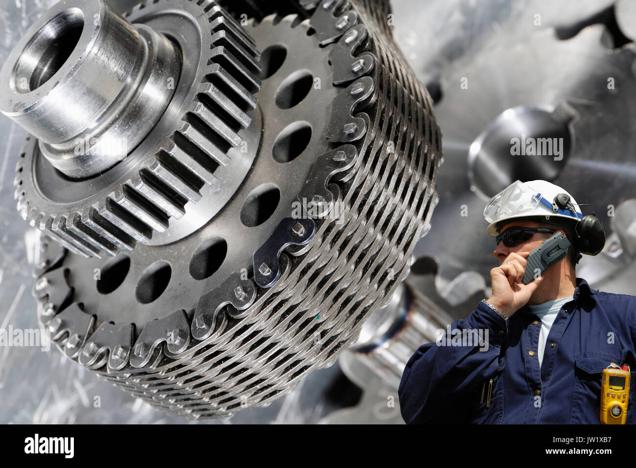 gears and cogs powered by large timing chain Stock Photo Alamy