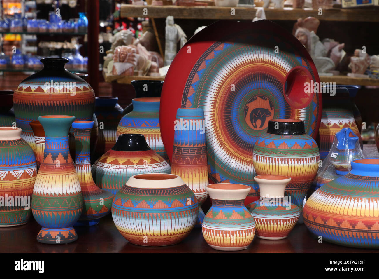 Shelves with hand made by native american souvenirs at historic trading post. Native american craft and culture background. Navajo etched pottery. Gra Stock Photo