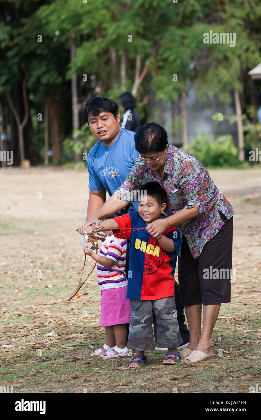 Nakhon Ratchasima Thailand Dec 30 08 Family Join Activity Shooting Seeds With Catapult In Thailand National Park Stock Photo Alamy