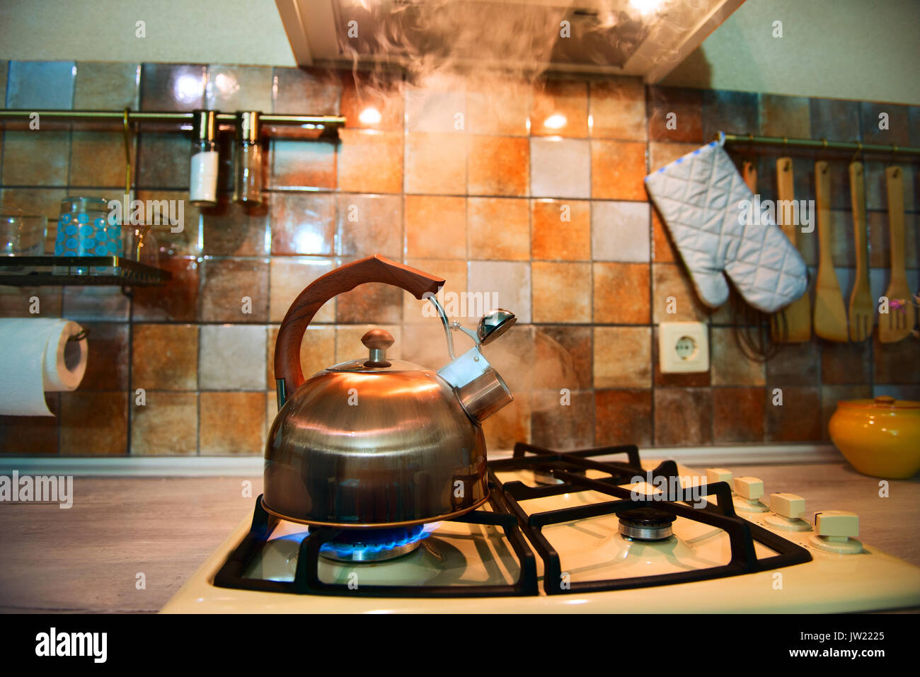 modern, trendy, bronze kettle on a new modern kitchen. From the kettle