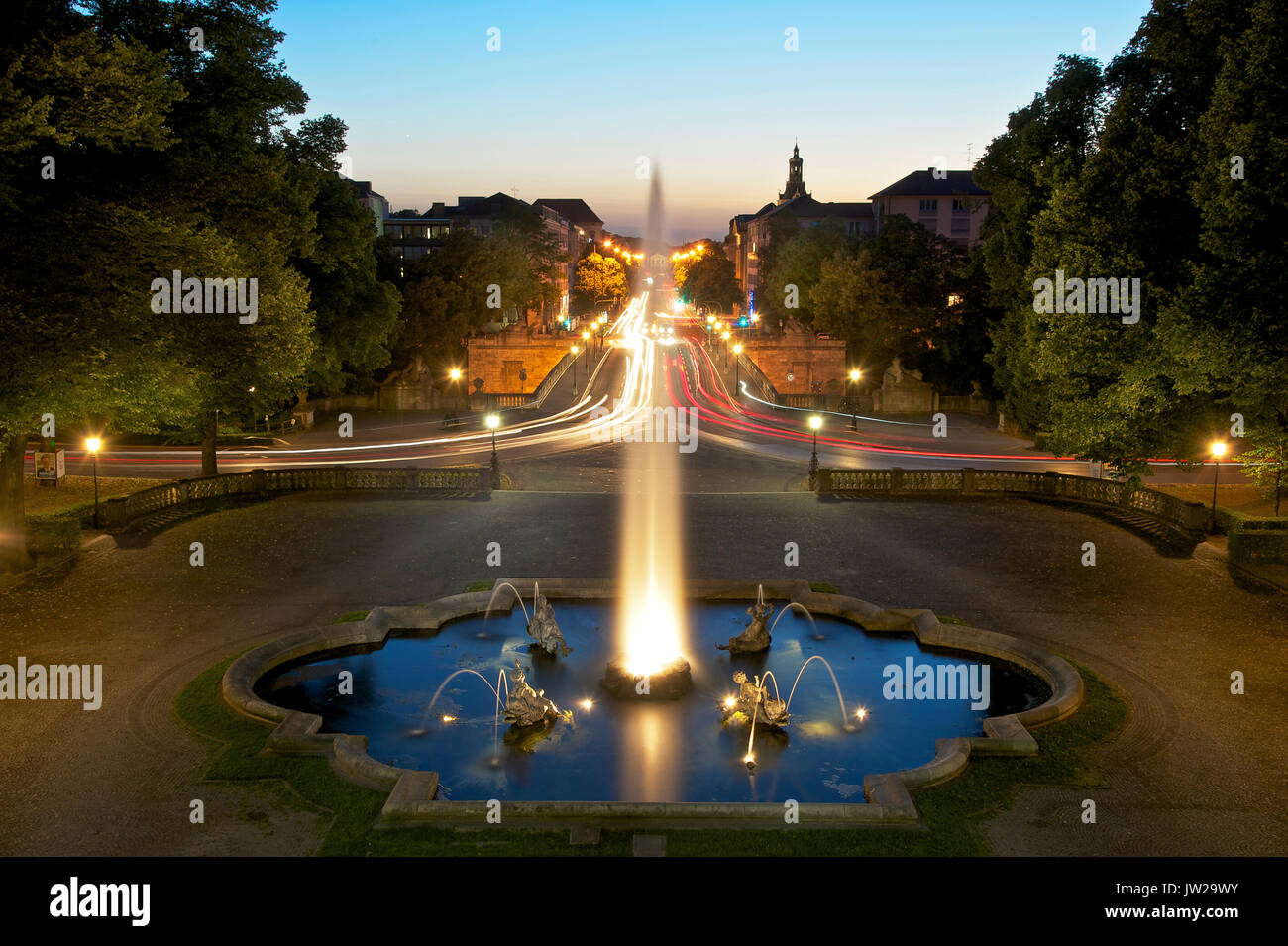 Prinzregent-Luitpold Terrace with fountain, view of Prinzregentenstraße with light trails, time exposure of driving cars Stock Photo