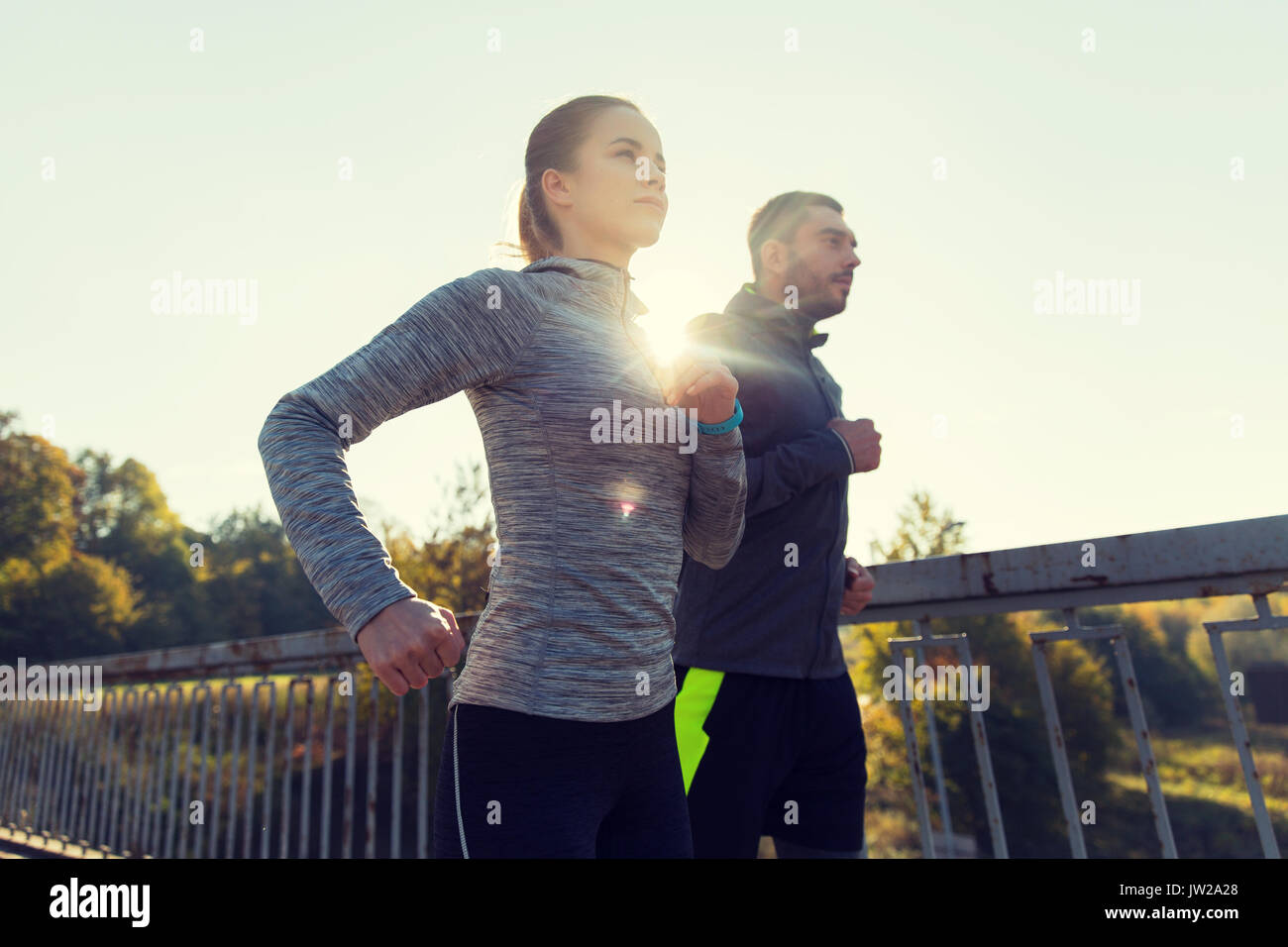 happy couple running outdoors Stock Photo - Alamy