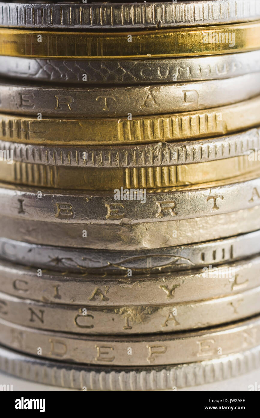 Stack of silver and gold international coins Stock Photo - Alamy
