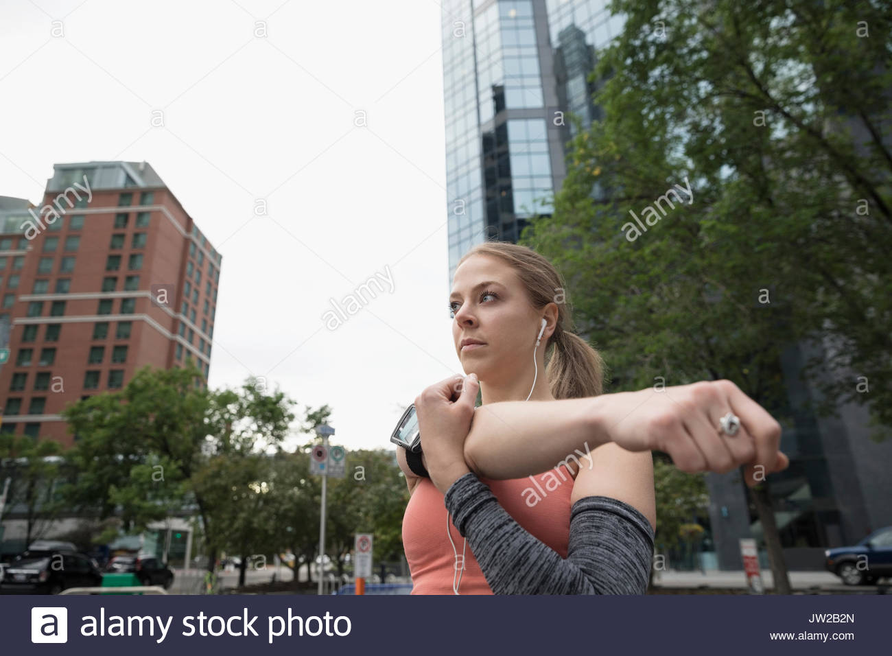 Woman stretching arms up standing hi-res stock photography and images ...