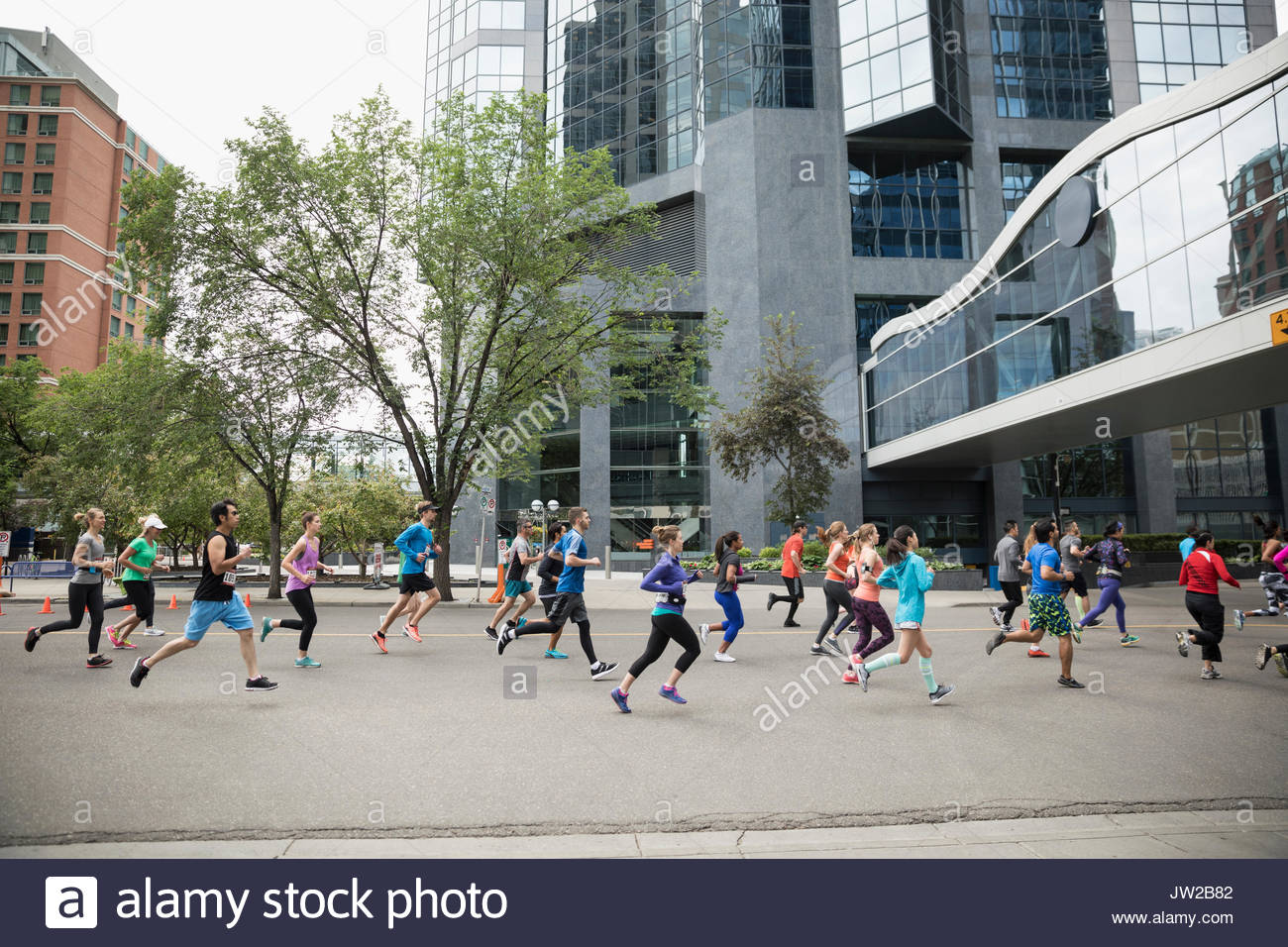 Marathon runners running on urban street Stock Photo