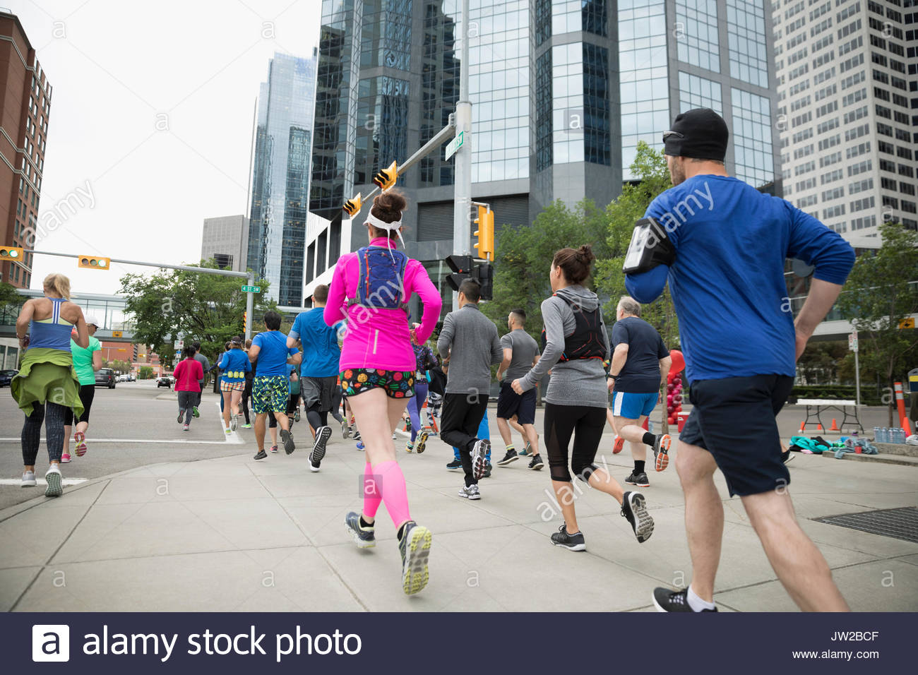 Marathon runners running on urban street Stock Photo Alamy