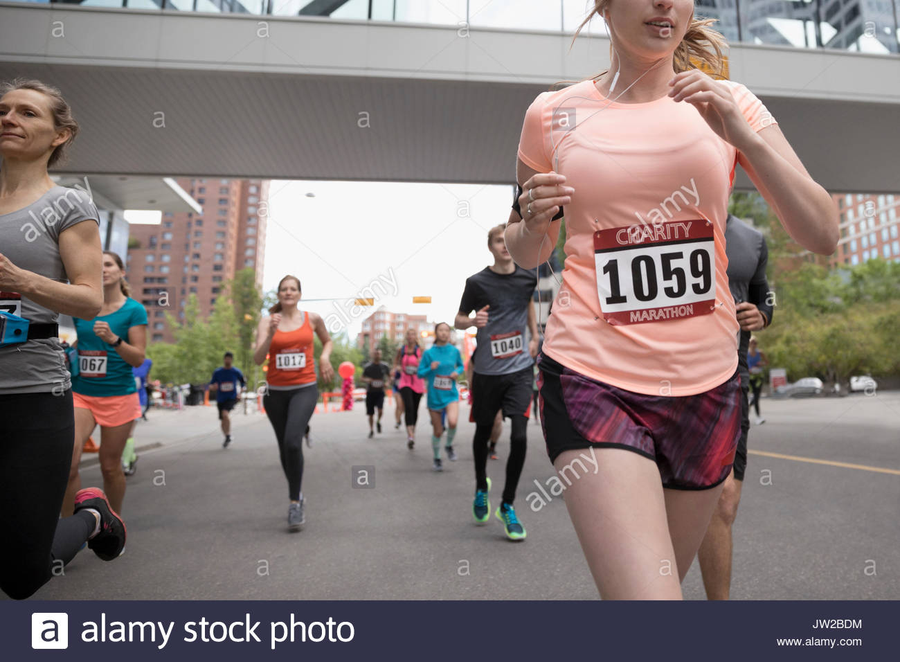 Marathon runners running on urban street Stock Photo Alamy