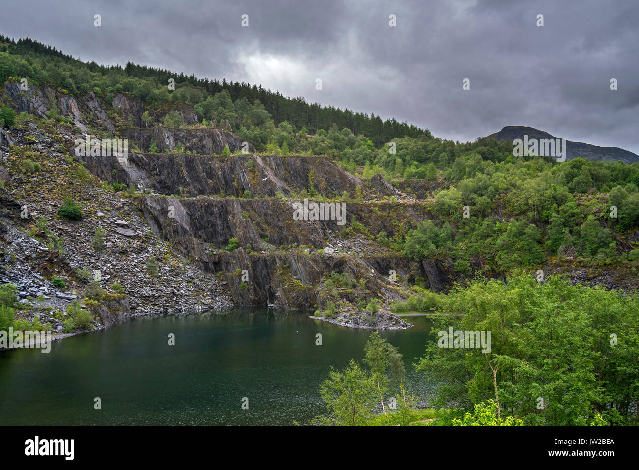 Abandoned Ballachulish slate quarry showing terraces and lake in Lochaber, Highland, Scotland, UK Stock Photo