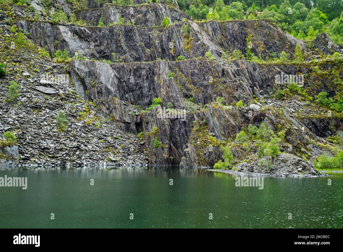 Abandoned Ballachulish slate quarry showing terraces and lake in Lochaber, Highland, Scotland, UK Stock Photo