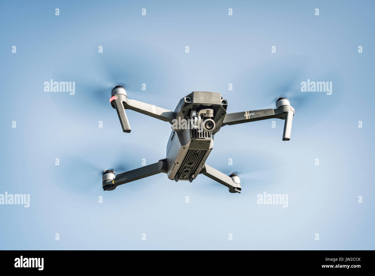 Flying quadrocopter, remote controlled drone with camera, DJI Mavic Stock Photo
