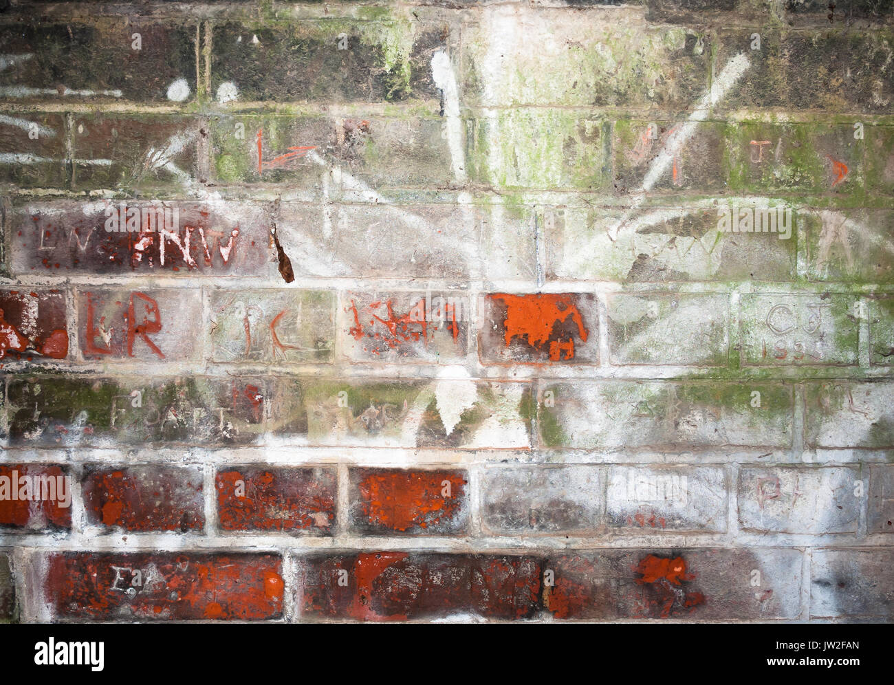 wall scratched and etched into inside tunnel; UK Stock Photo