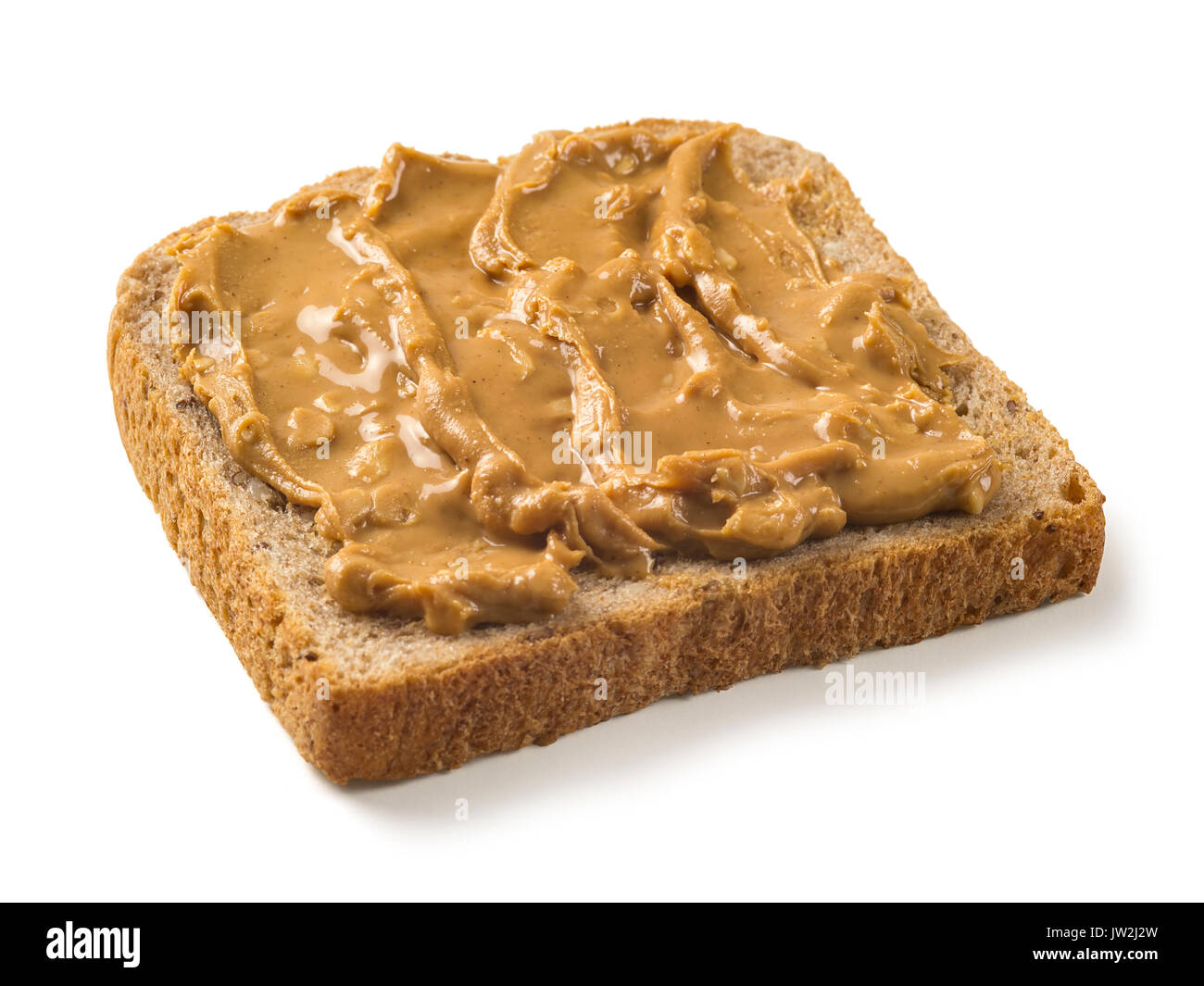 Photo of a slice of whole wheat bread covered in peanut butter