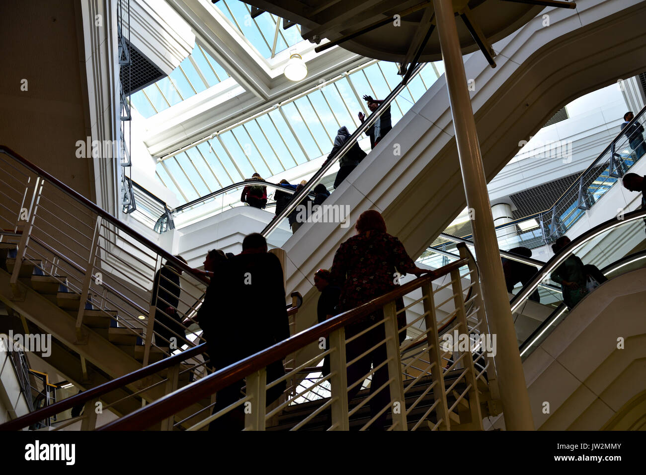 Stairs, escalators, people going up going down abstract Stock Photo