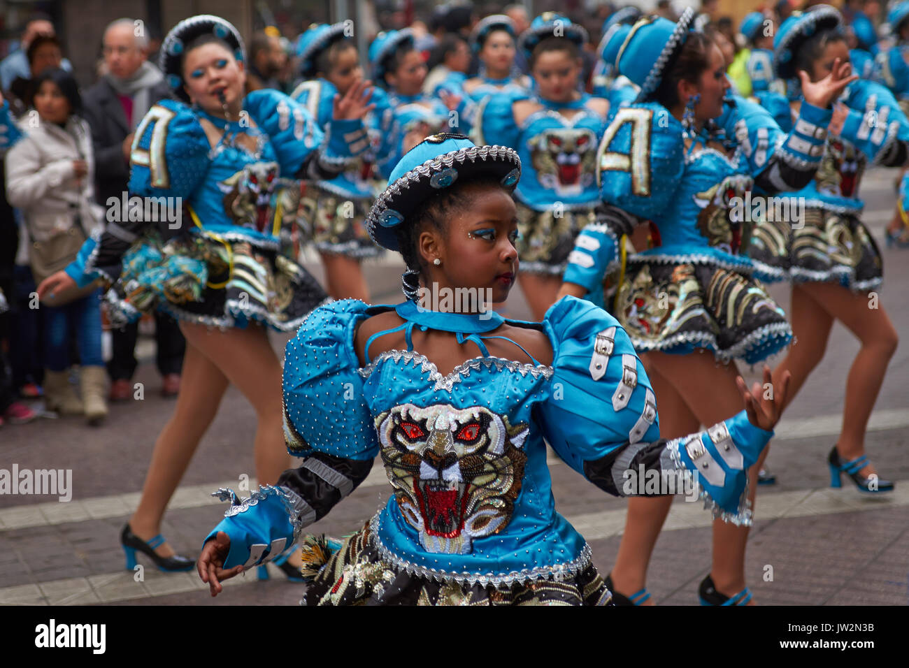 Caporales dance group parading through the centre of Santiago, Chile to ...