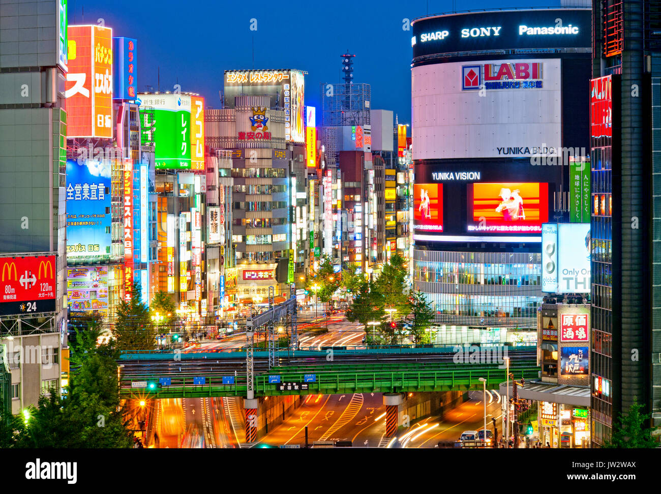 Shinjuku Tokyo Skyline Billboards Japan Yasukuni Dori Kabukicho at night. Stock Photo
