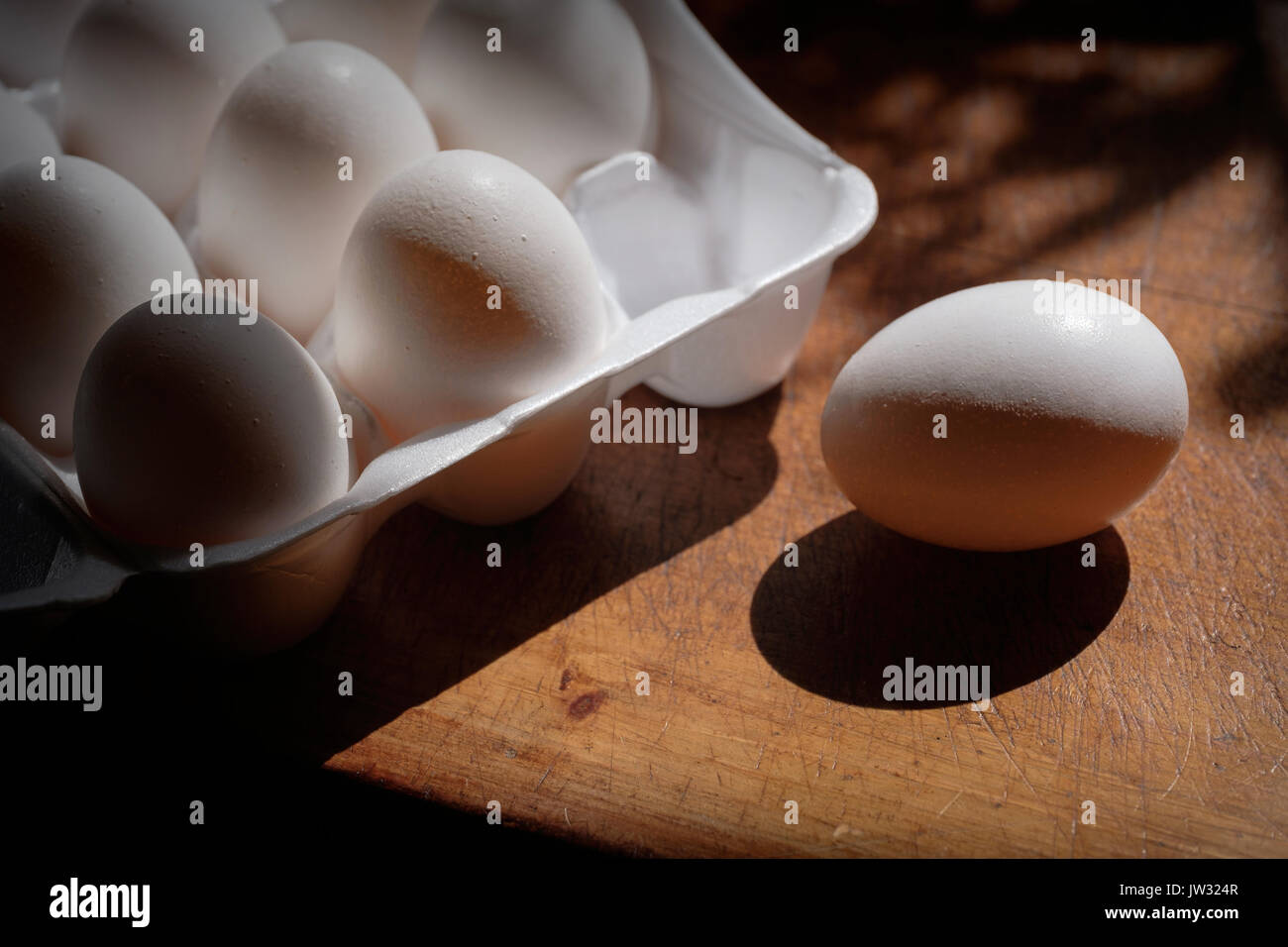 Fresh eggs in carton on table Stock Photo