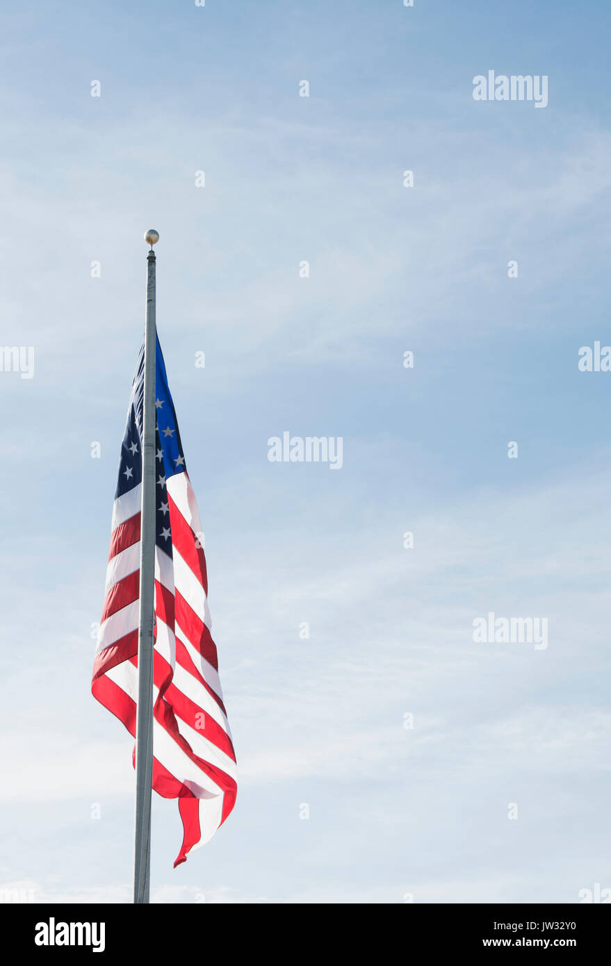 American flag against blue sky Stock Photo - Alamy