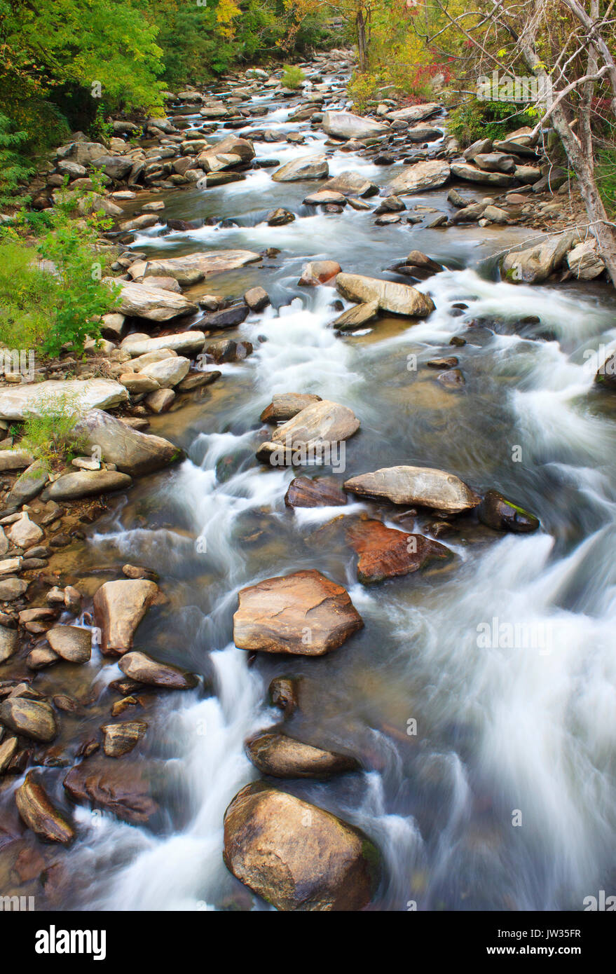 Fast moving river water at Buffalo Creek Chimney Rock Village near lake