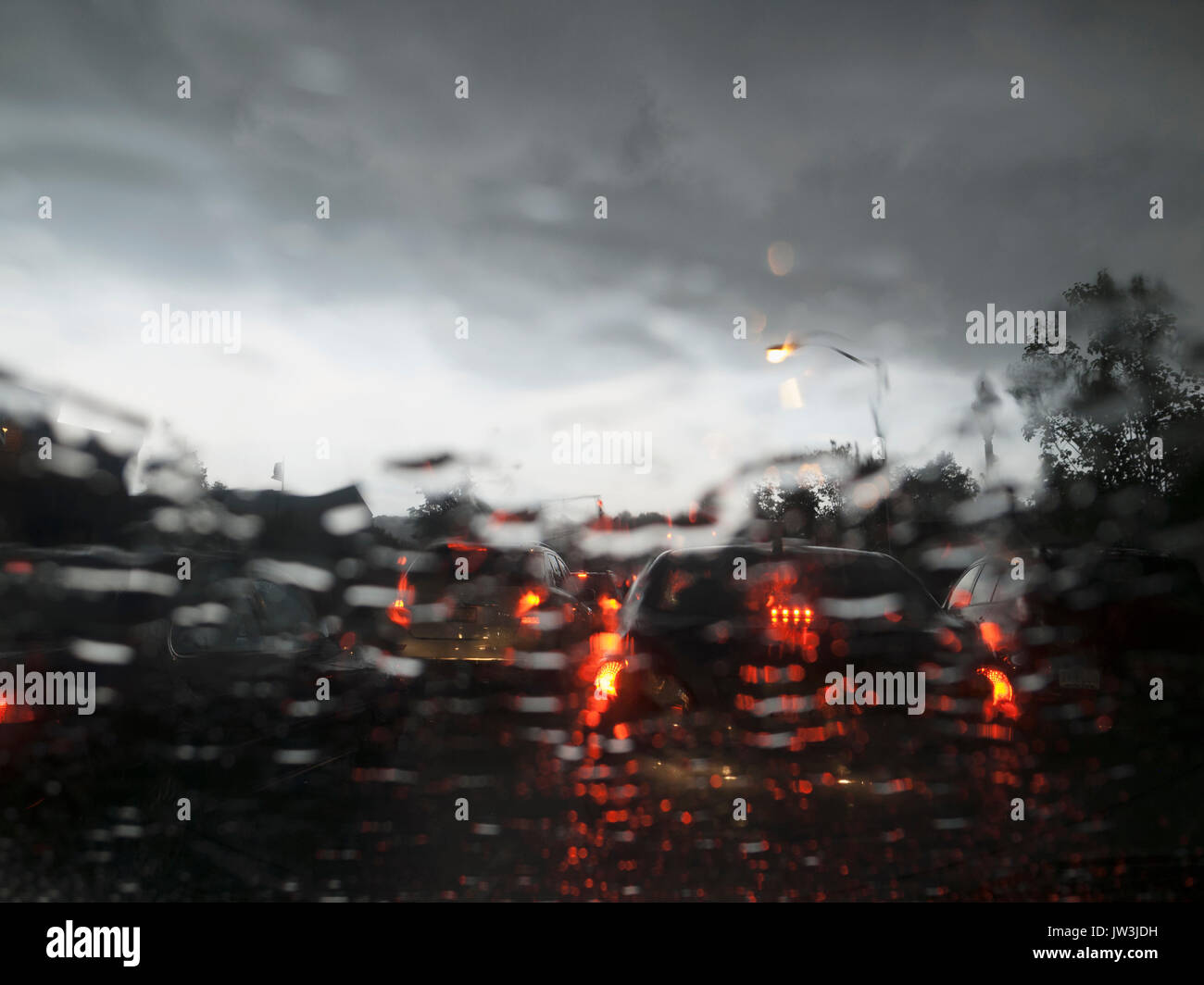 Street traffic on rainy day Stock Photo - Alamy