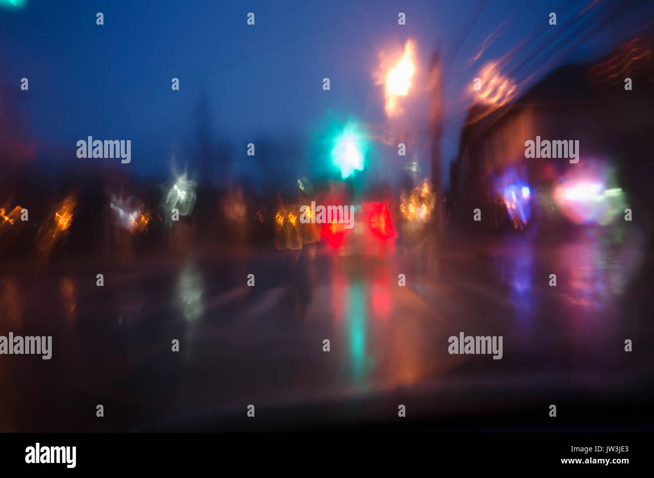 Street traffic at rainy night Stock Photo