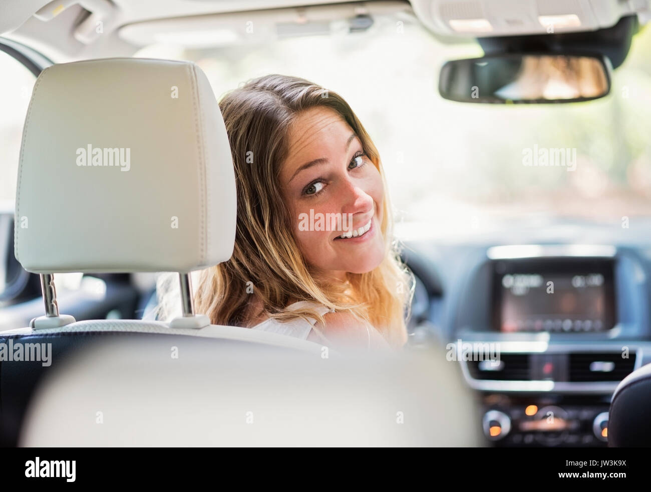 Portrait of woman in modern car Stock Photo