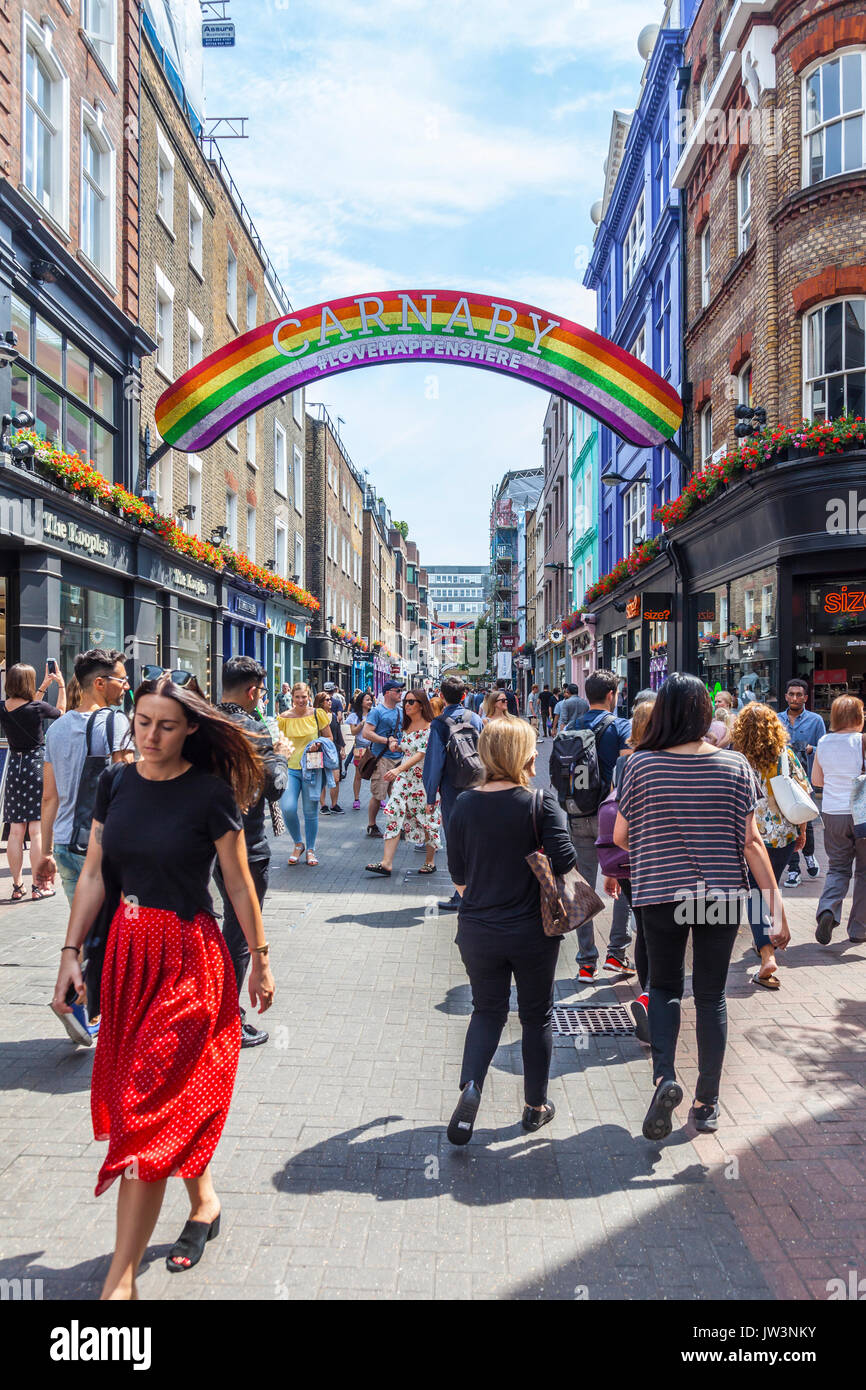 Shoppers and tourists in Carnaby Street, the famous pedestrianised shopping street in Soho, City of Wwestminster, London, England, UK Stock Photo