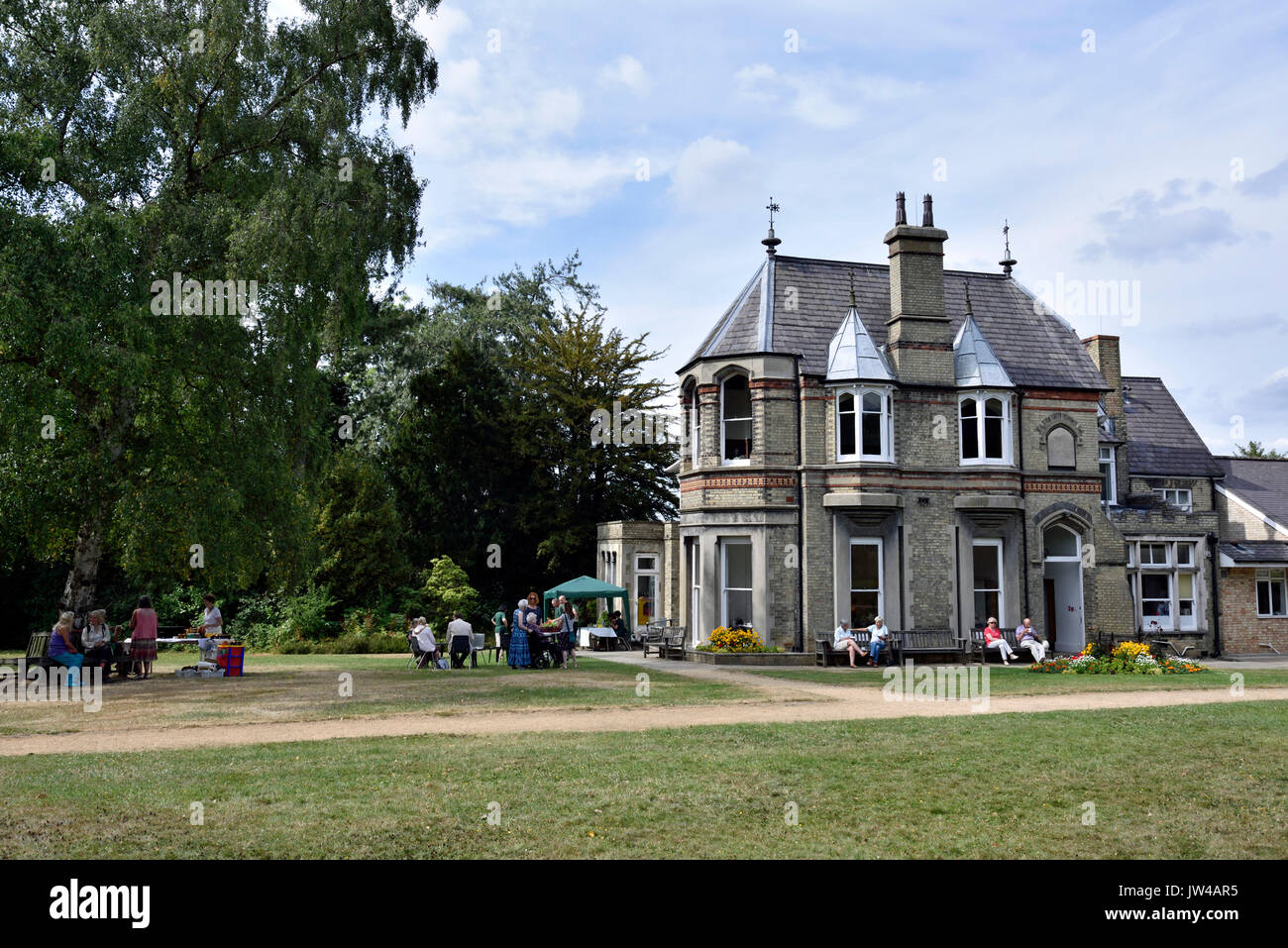 North Bank House a Victorian villa with people in garden Muswell Hill London Borough of Haringey England Britain UK Stock Photo