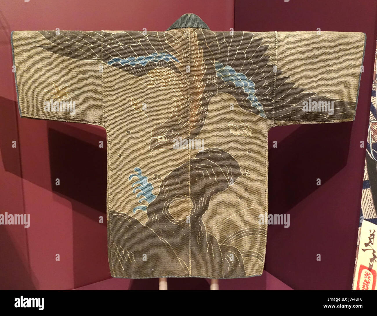 This fireman's coat, originating from Japan during the Late Edo period (1800-1850 AD), features intricate paste resist dyeing techniques. The garment provides insight into the textile craftsmanship and cultural practices of the era. Stock Photo