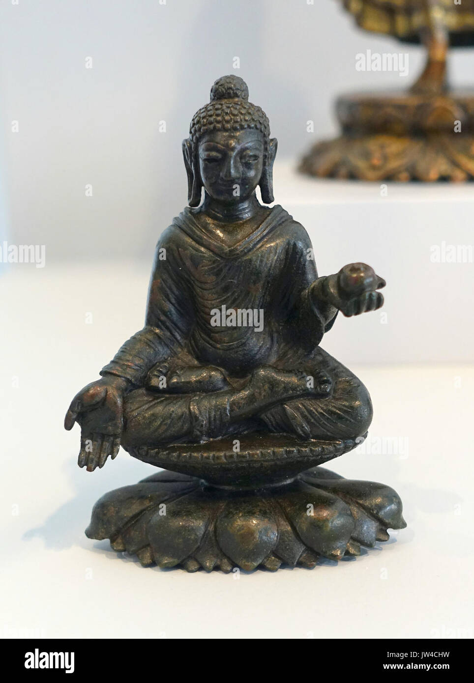 Seated Buddha with Left Hand Holding a Covered Jar, Late Gandharan style, Pakistan, Swat Valley, Swat District, Khyber Pakhtunkhwa, 9th cent , bronze   Arthur M  Sackler Museum, Harvard University   DSC00843 Stock Photo