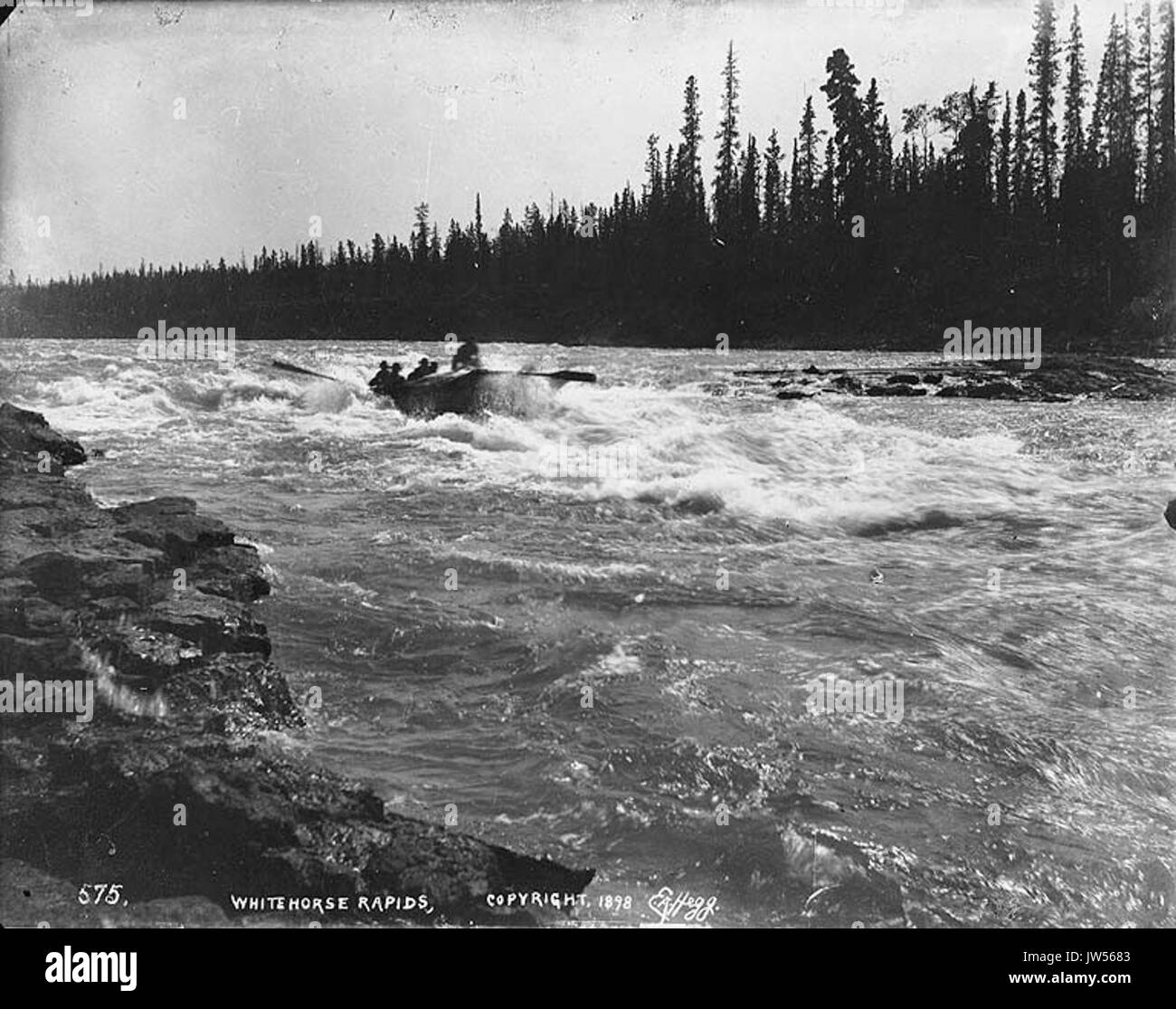 Boat navigating Whitehorse Rapids on the Yukon River, Yukon Territory