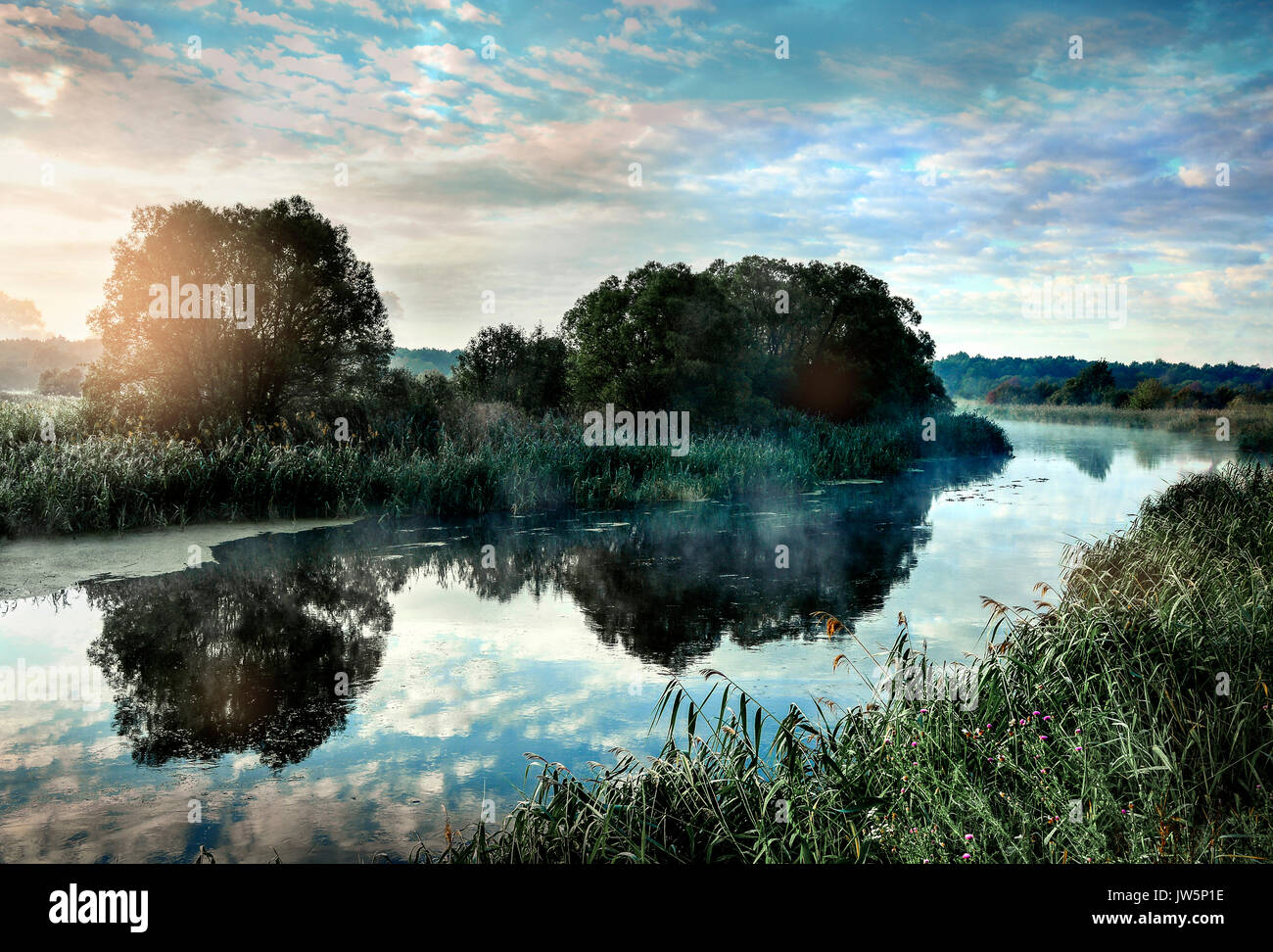 Photo with a sunny summer sunrise over the river Stock Photo - Alamy