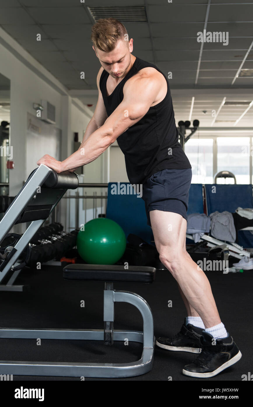 Bodybuilder Doing Heavy Weight Exercise For Legs Calves Stock ...