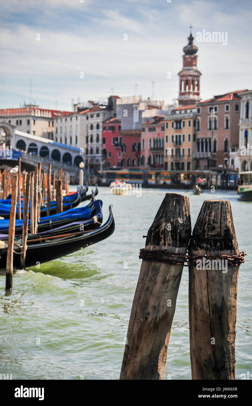 Close-up of wooden docking posts on the Grand Canal, Venice, Italy Stock Photo