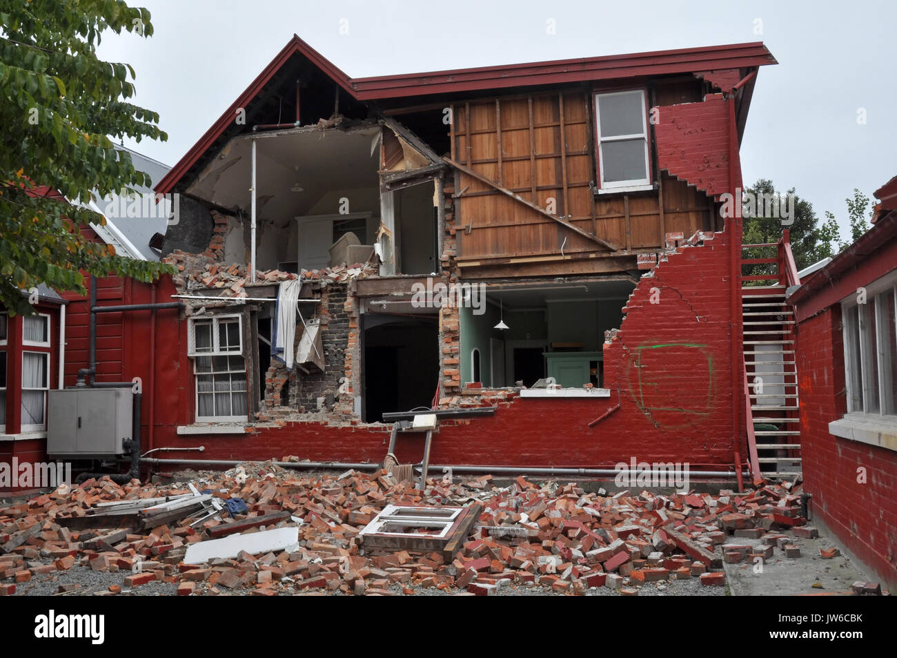Christchurch, New Zealand - March 12, 2011: A brick house on historic Cranmer Square collapses from the impact of the massive  earthquake on March 12, Stock Photo