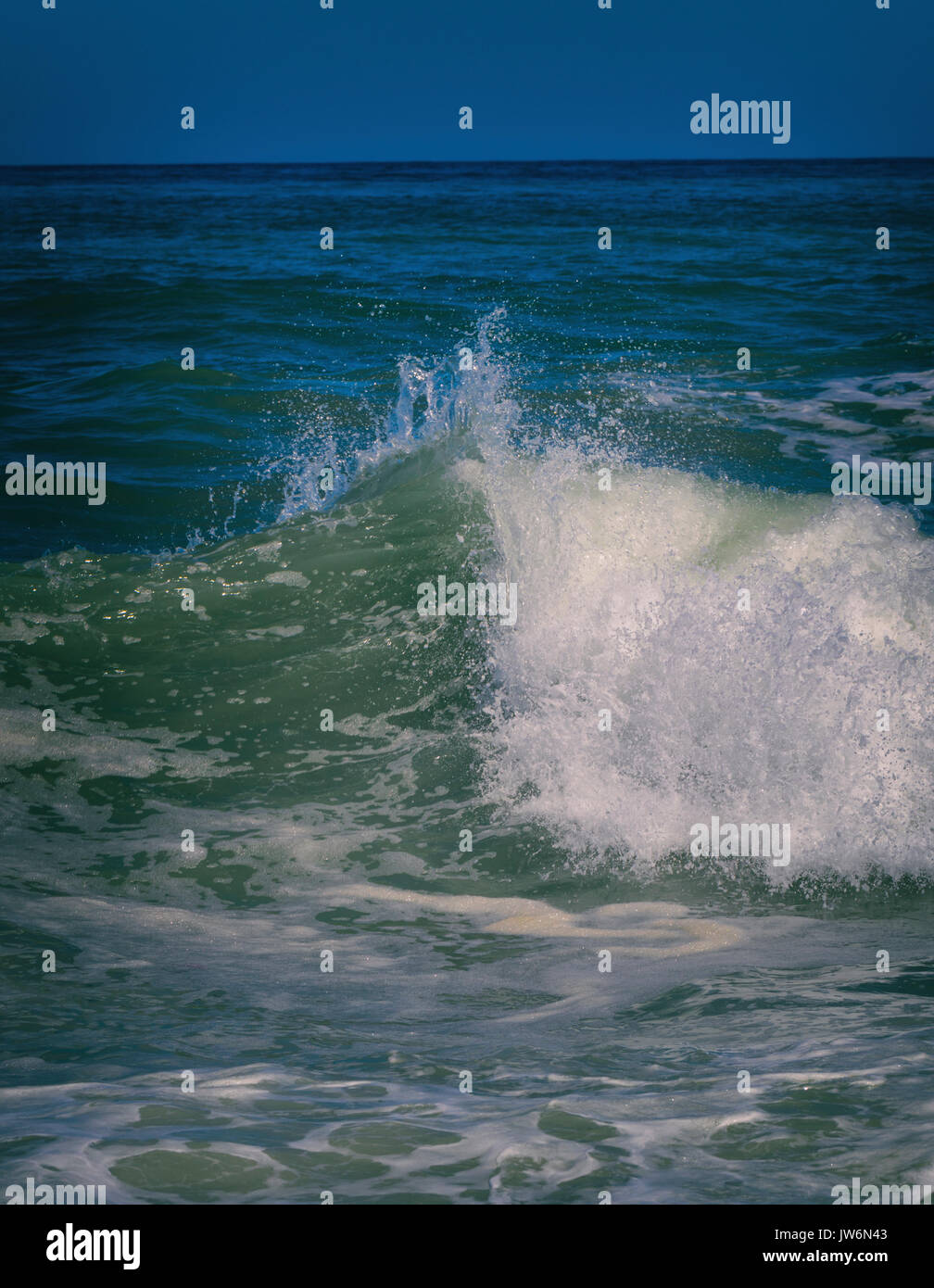Breaking wave abstracted in post-processing. Stock Photo