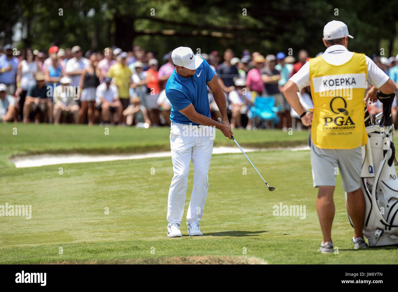 10th August 2017, Quail Hollow, Charlotte, NC, USA; Brooks Koepka chips to the 9th green during 1st round action at the PGA Championship at the Quail Hollow Club Charlotte, Stock Photo