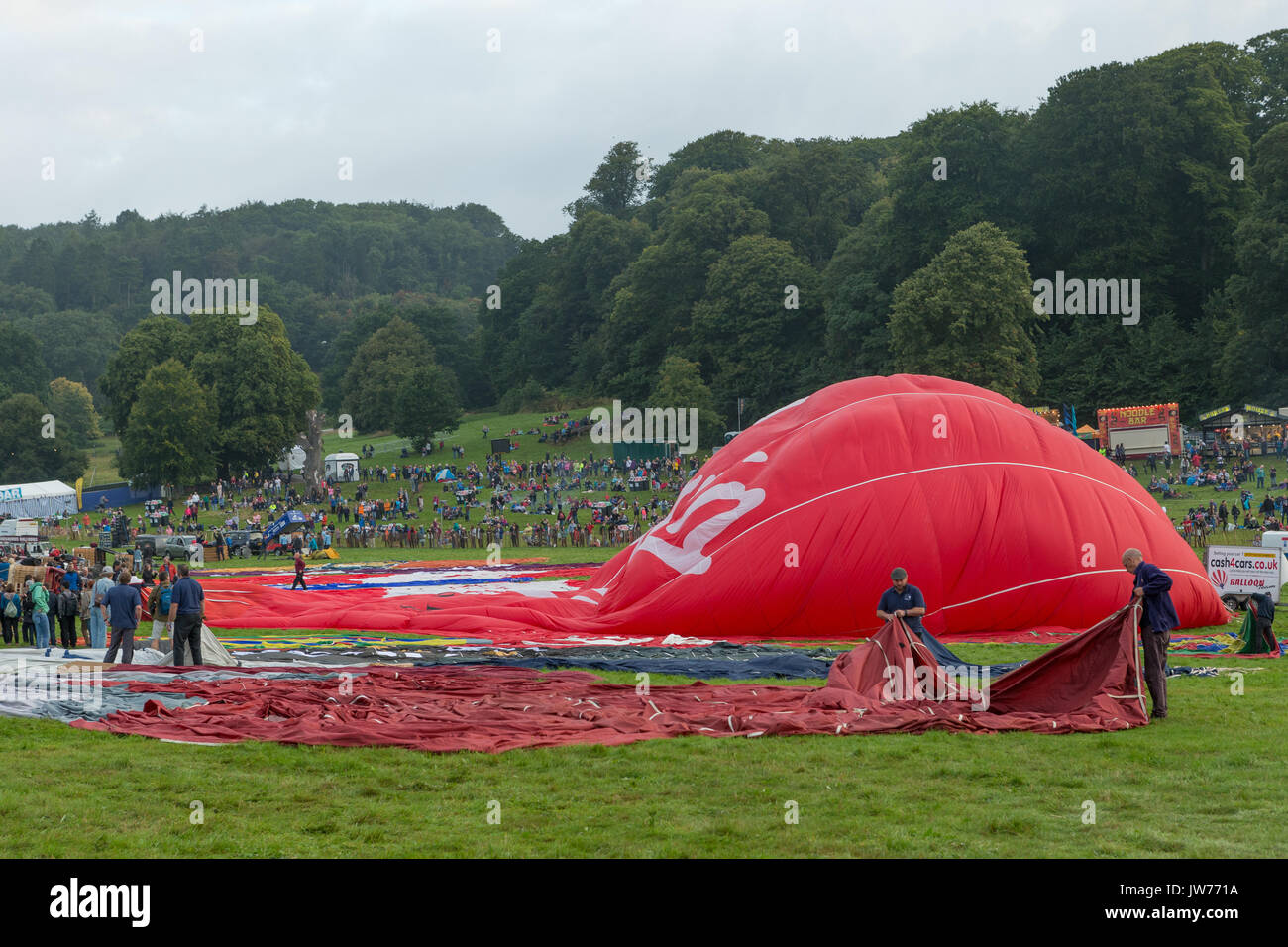 Ashton Court, Bristol, UK. 12 August 2017.  After the disappointing rain on Friday evening, the weather improves to allow 28 hot air balloons to fly over Bristol before the launch was curtailed due to worsening weather conditions. The third planned ascent at this year’s Bristol International Balloon Fiesta was in front of a large crowds at Ashton Court, Bristol. Stock Photo